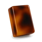 Single Amber mahjong tile from the back, showing solid tortoiseshell acrylic