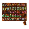 Amber American mahjong tiles, one of each tile laid out in a grid with one tile face down showing the tortoiseshell back