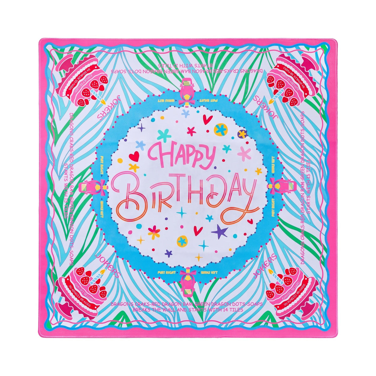 Aqua palm frond mahjong mat with layer cakes and Happy Birthday lettering, shown flat from above on white