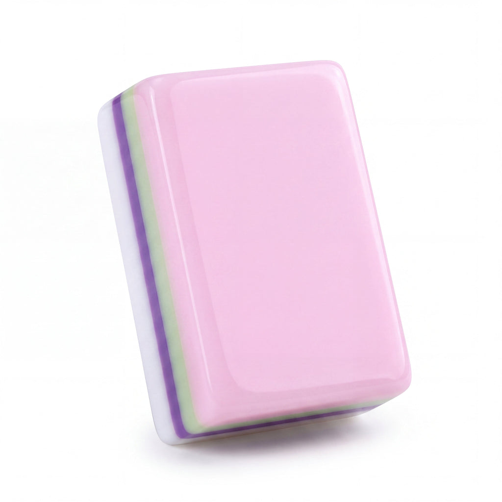 Single Bloomsbury mahjong tile from the back, showing the soft pastel pink back