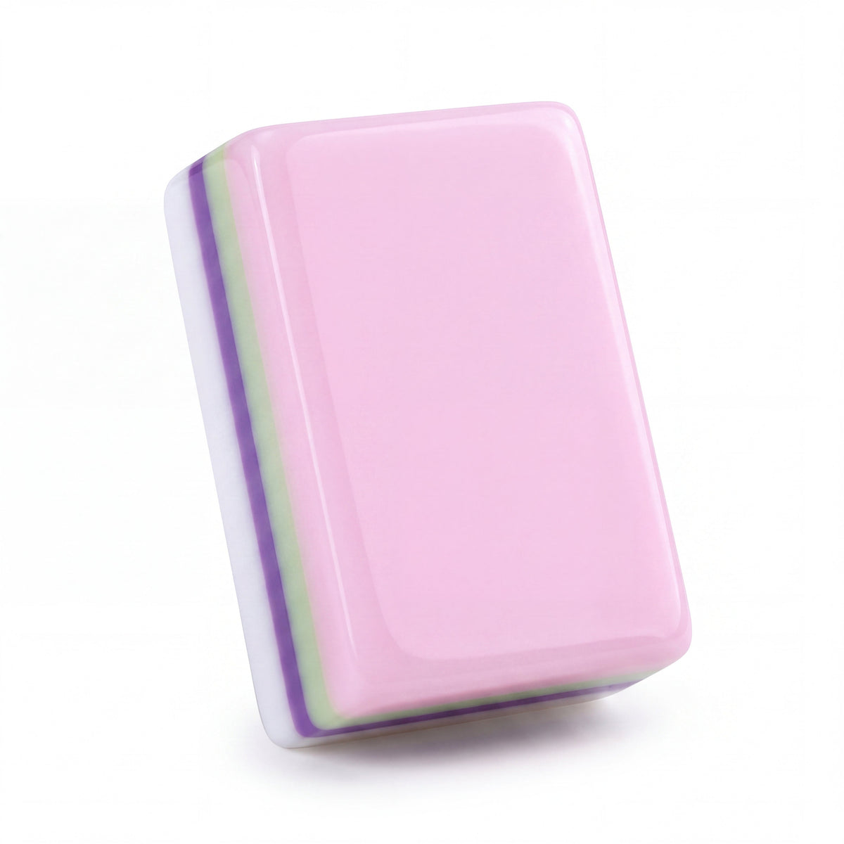 Single Bloomsbury mahjong tile from the back, showing the soft pastel pink back