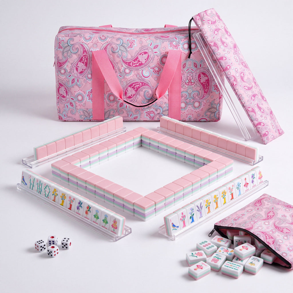 Bloomsbury American mahjong starter kit with pale pink backed tiles walled inside four clear racks, a quilted pink paisley tote, drawstring rack sleeve and zippered tile pouch