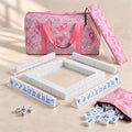 Blue Willow American mahjong starter kit with pearly white tile walls inside four clear racks and a quilted pink paisley carrying set
