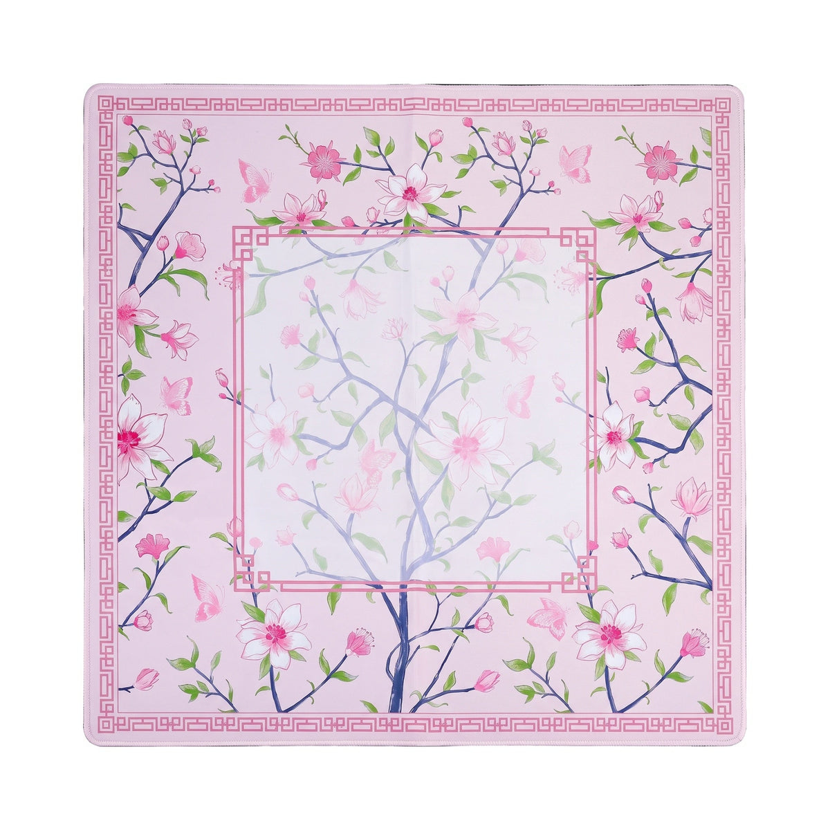 Pink magnolia mahjong mat on soft pink with a rose Greek key frame, shown flat from above on white