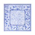 Cobalt flowering branch and butterfly mahjong mat on white with a double Greek key frame, shown flat from above