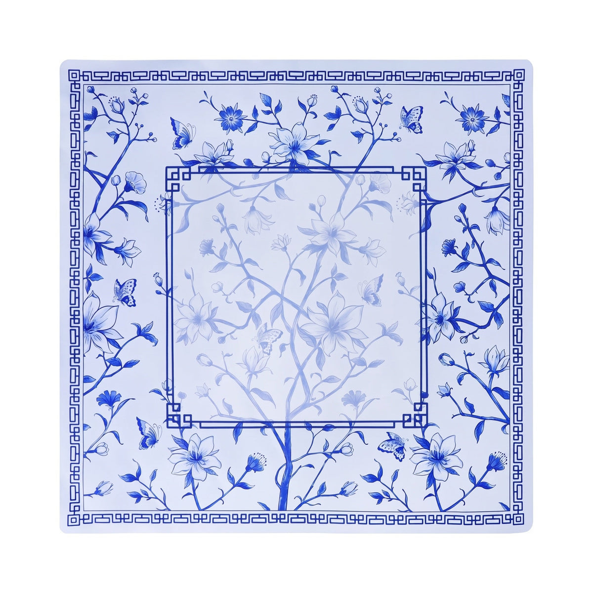 Cobalt flowering branch and butterfly mahjong mat on white with a double Greek key frame, shown flat from above