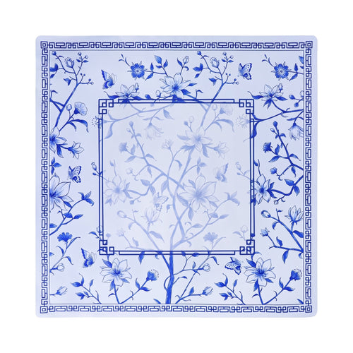 Cobalt flowering branch and butterfly mahjong mat on white with a double Greek key frame, shown flat from above