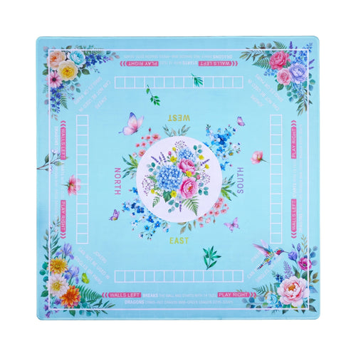 Turquoise mahjong mat with peony and rose bouquets banked into the corners, shown flat from above on white