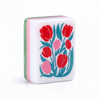 Single Empress mahjong tile showing painted red tulips and the pink, white and green layered edge