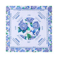 Blue and white hydrangea mahjong mat with a bluebird in the center circle, shown flat from above on white
