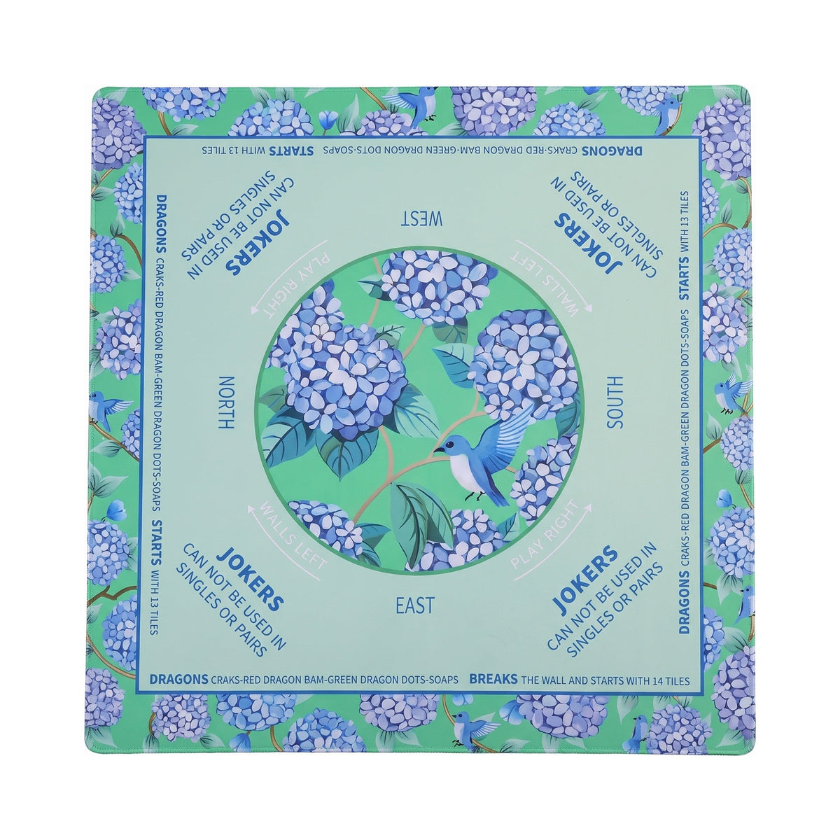 Grass green and mint hydrangea mahjong mat with a bluebird in the center circle, shown flat from above on white