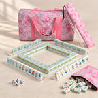 Jade Pavilion American mahjong starter kit with jade tile walls inside four clear racks and a quilted pink paisley carrying set