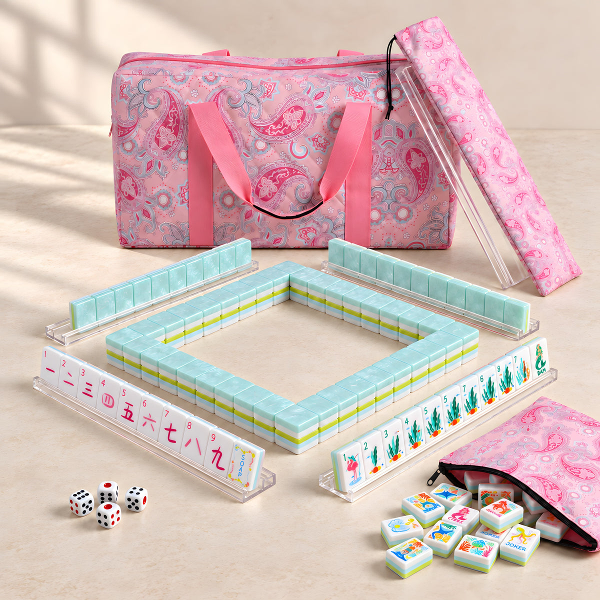 Mermaid American mahjong starter kit with pearly aqua backed tiles walled inside four clear racks, a quilted pink paisley tote, drawstring rack sleeve and zippered tile pouch