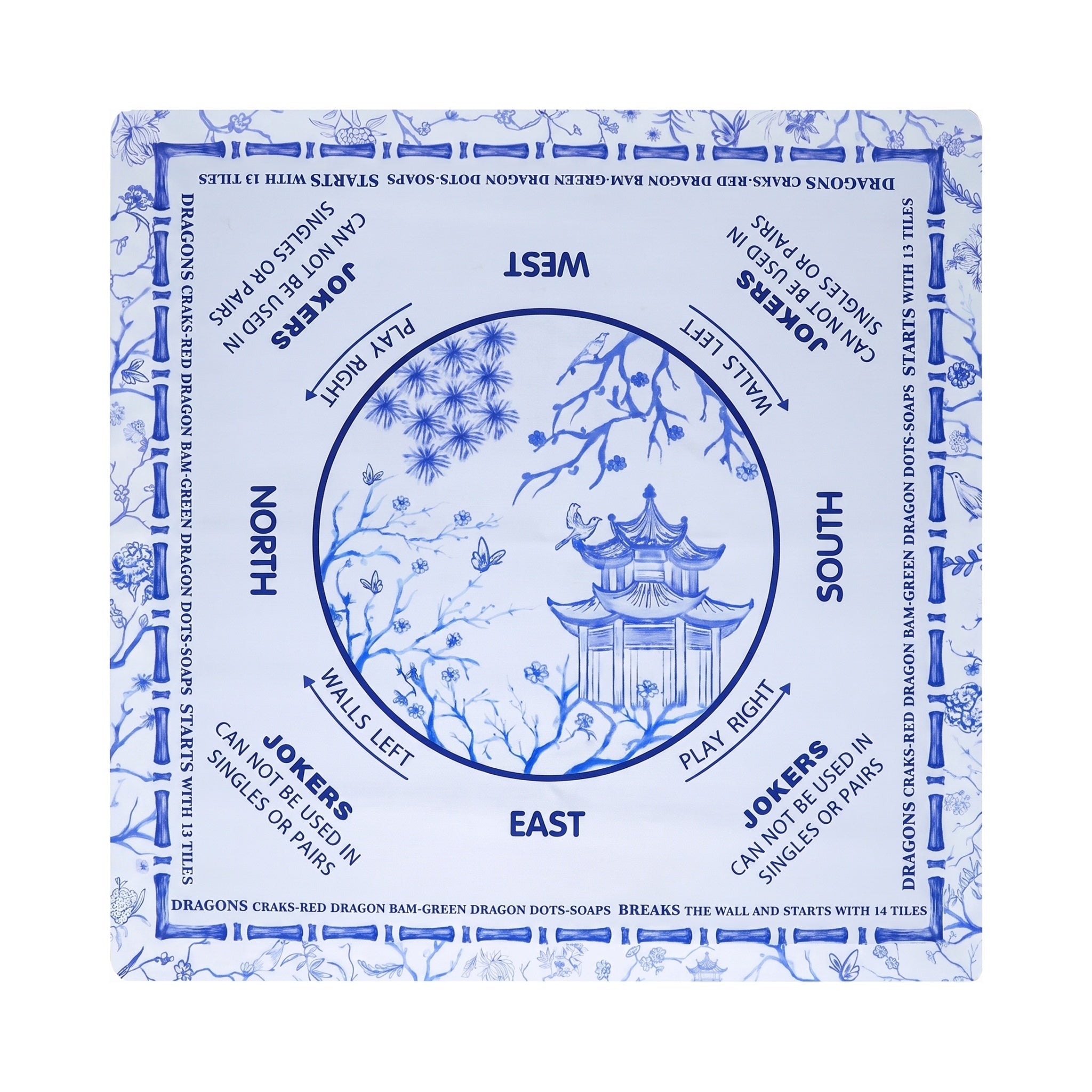 Blue and white chinoiserie mahjong mat with a tiered pagoda in the center circle, shown flat from above on white