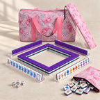 Plum Blossom American mahjong starter kit with purple tile walls inside four clear racks and a quilted pink paisley carrying set