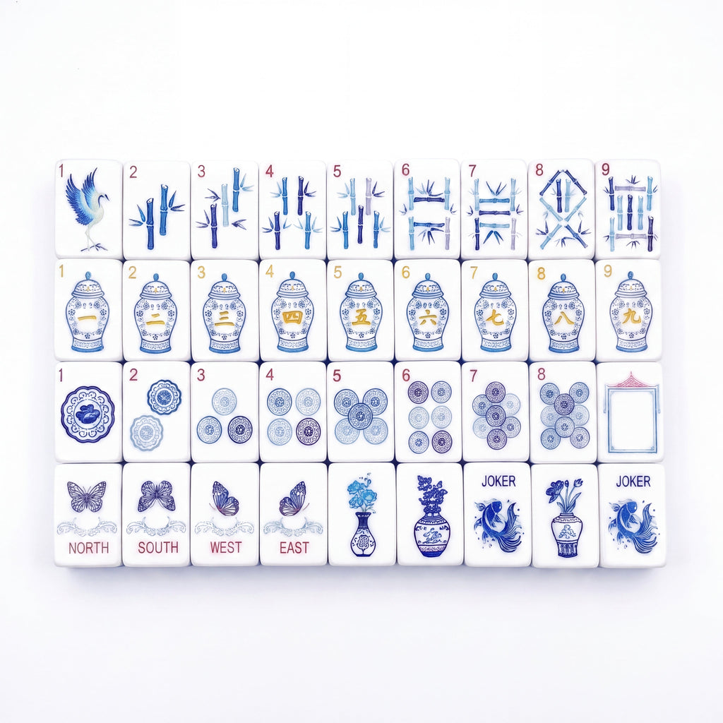 Porcelain American mahjong tiles laid out in full, with blue and white ginger jar craks, bamboo bams and porcelain medallion dots