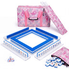Porcelain American mahjong starter kit with cobalt blue backed tiles walled inside four clear racks, a quilted pink paisley tote, drawstring rack sleeve and zippered tile pouch