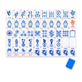 Porcelain American mahjong tiles, one of each tile laid out in a grid with one tile face down showing the cobalt blue back