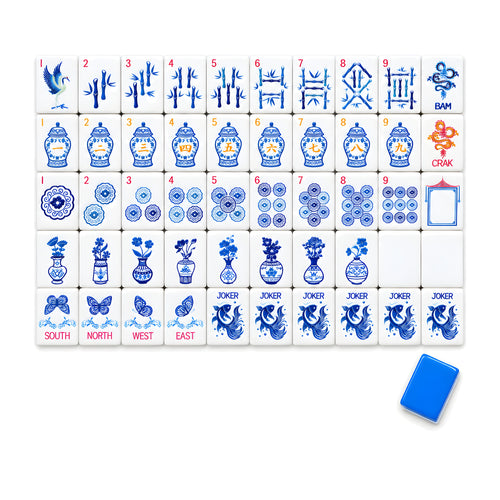 Porcelain American mahjong tiles, one of each tile laid out in a grid with one tile face down showing the cobalt blue back