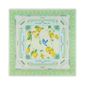 Cream lemon branch mahjong mat with a grass green Greek key border, shown flat from above on white