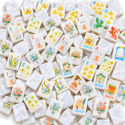 Princess Pearl American mahjong tiles scattered face up and face down, showing pearly white backs