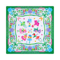 White mahjong mat with green ribbon swags, blue carnations and flower fairies, shown flat from above on white