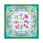 White mahjong mat with green ribbon swags, blue carnations and flower fairies, shown flat from above on white