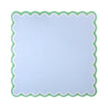Plain pale blue mahjong mat with a white and spring green scalloped border, shown flat from above on white