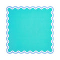 Plain turquoise mahjong mat with a white and periwinkle scalloped border, shown flat from above on white