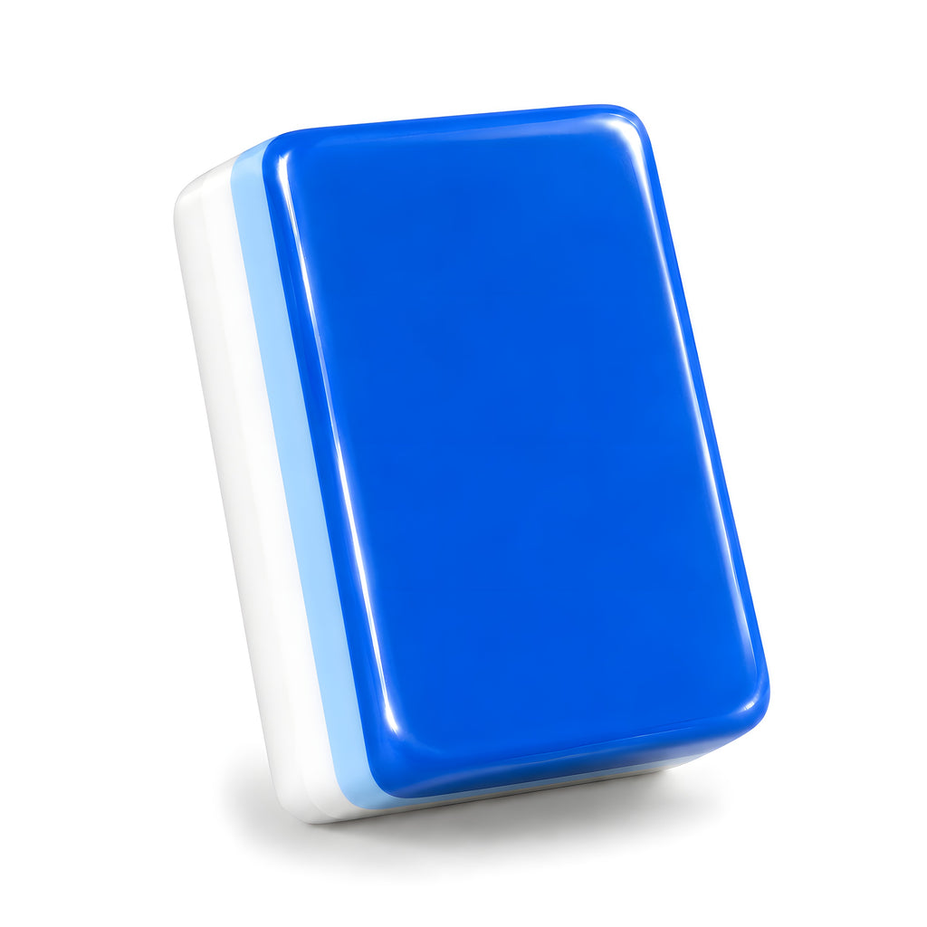 Single Snow Day mahjong tile from the back, showing the cobalt blue back and layered side