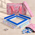 Snow Day American mahjong starter kit with cobalt blue tile walls inside four clear racks and a quilted pink paisley carrying set