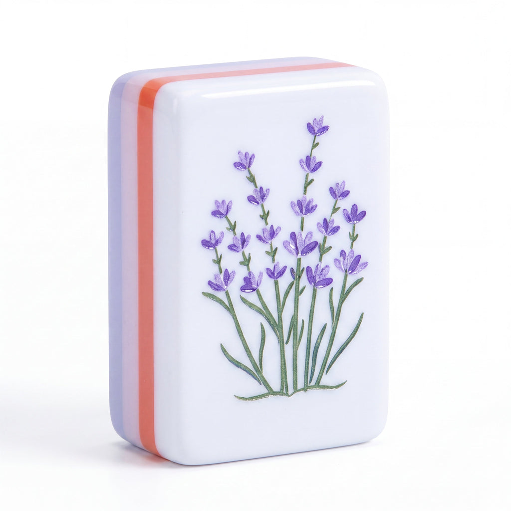 Single Violette mahjong tile showing purple lavender sprigs and the lavender and coral layered edge