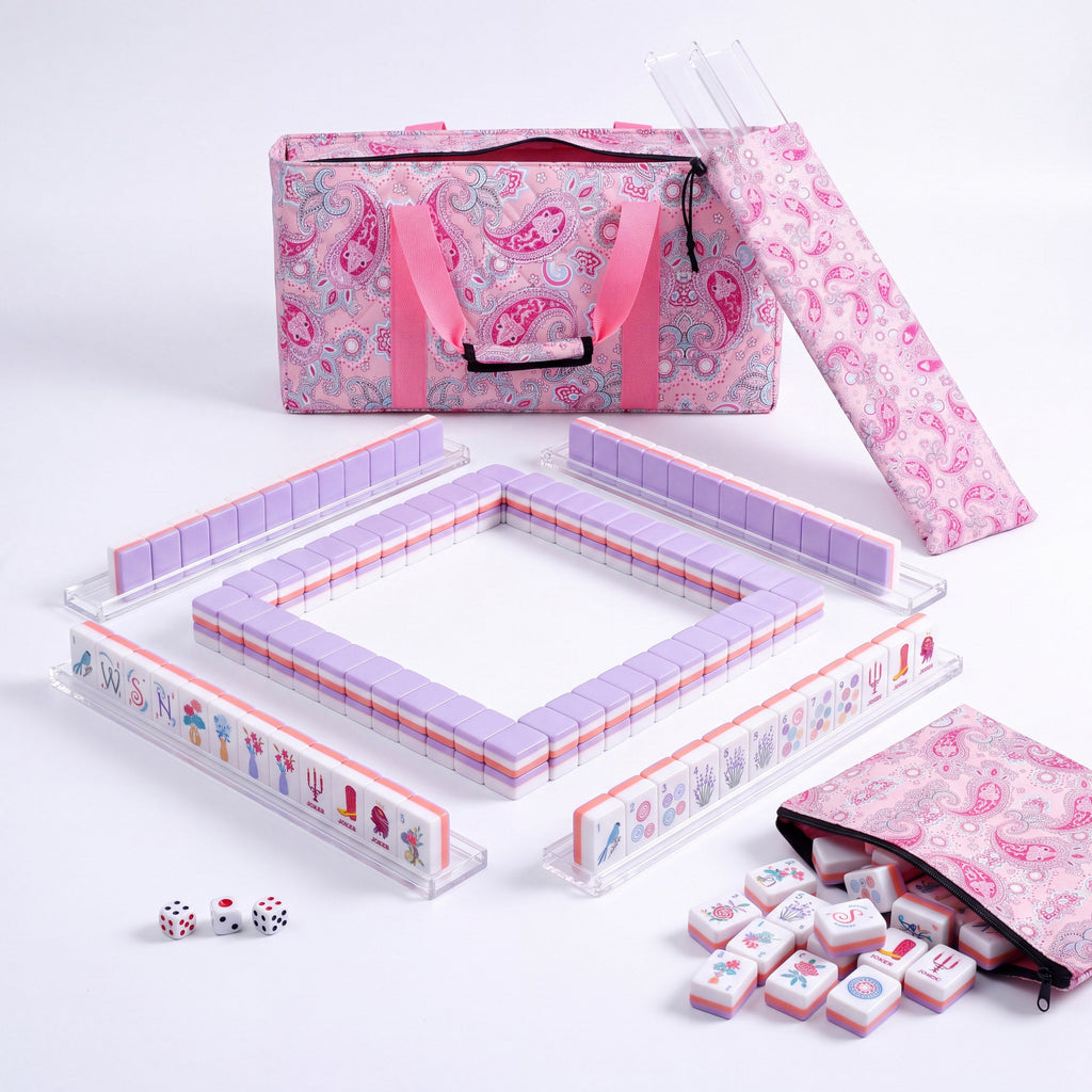 Violette American mahjong starter kit with lilac backed tiles walled inside four clear racks, a quilted pink paisley tote, drawstring rack sleeve and zippered tile pouch